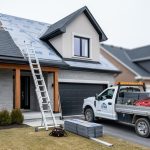 Roofing renovation on a Quebec home with a contractor ladder, new shingles, and a work truck in the background under overcast daylight.